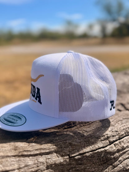 Side view of the white Remuda Longhorn Trucker Hat showing the mesh back and embroidered maker’s mark